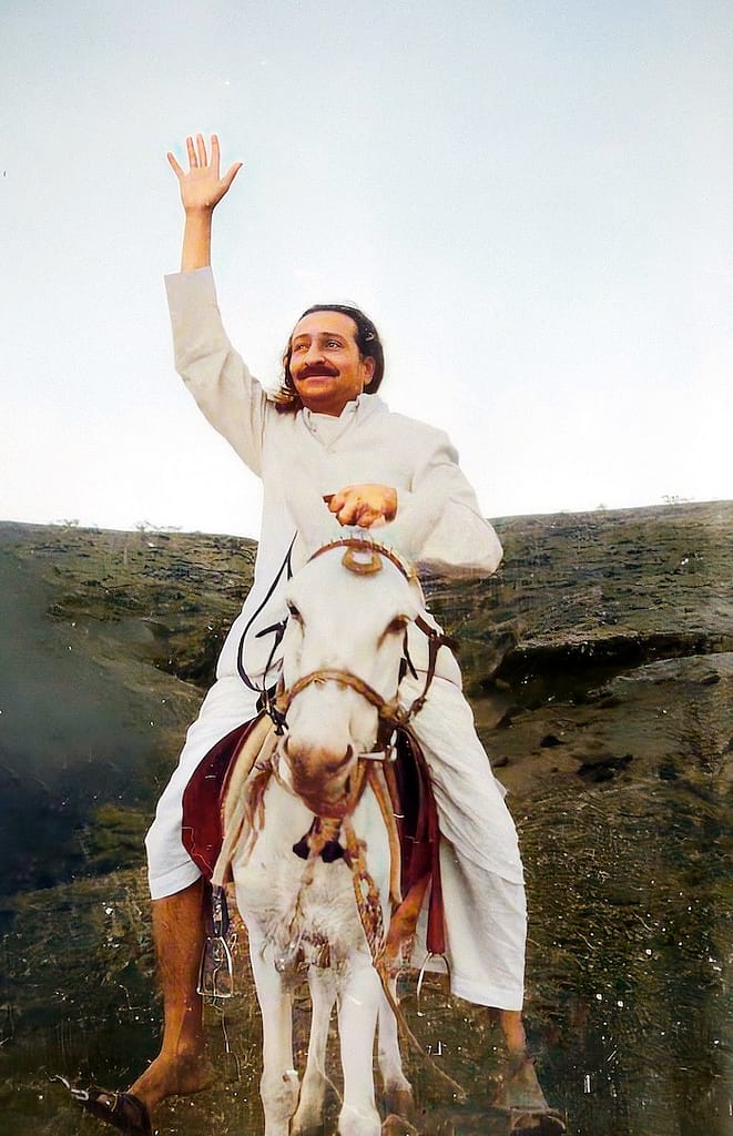 Meher Baba riding donkey Champa